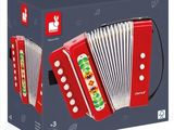 an image of a red and white accordion sitting in front of a blue box
