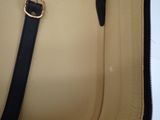 a close up of a purse with a strap on it