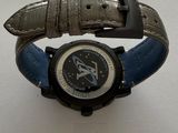 a watch that is sitting on top of a table
