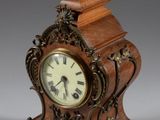 a small clock that is sitting on a table