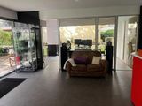 a living room with a couch and a television in it