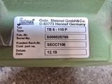 an image of a close up of a green machine with a label on it