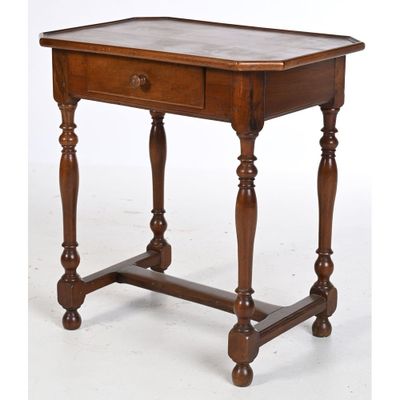 an old wooden table with a drawer on top of it