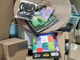 a pile of books and other items in a box