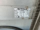 a sign on the side of a machine that says still