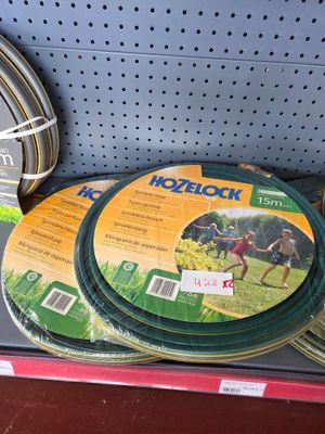 many different types of garden hoses on the shelf