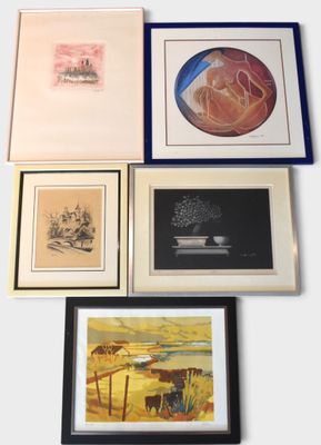 four framed pictures on the wall of a room