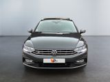 the front view of a black volkswagen vw parked in a room