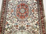 an oriental rug with a floral design on a white background