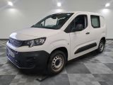 the white van is parked on a checkered floor in a room