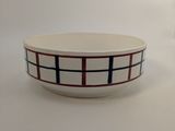 white bowl with black and red lines on it
