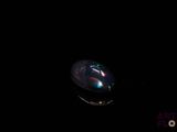 an image of a soap bubble floating in the dark