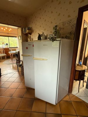 an image of a kitchen with a refrigerator in it