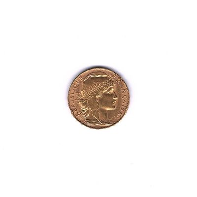 l'image d'une pièce d'or sur laquelle figure l'image d'un homme