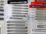 many different types of drill bits in a plastic box