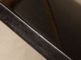 a close up of a black table with a glass top