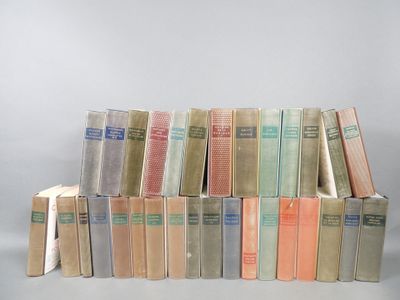 several books are stacked on top of each other on a table