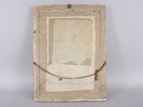 an old picture frame with a rope hanging from it ' s side