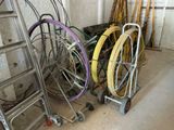 a lot of different types of hoses and wheels in a room
