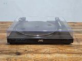 an image of a record player sitting on top of a wooden table