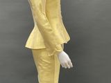 an image of a mannequin wearing a yellow suit and hat