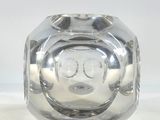 a clear glass vase with a smiley face on it