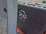 a close up of a car door handle with a sticker on it