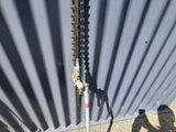 a pole with a pole cutter on it in front of a building