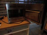 a microwave that is sitting on a counter in a kitchen