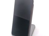 a cell phone that is sitting on top of a stand