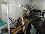 a kitchen with a lot of tools on the shelves