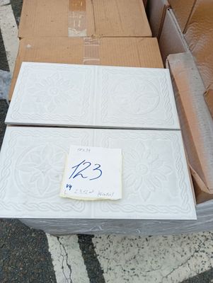 a box with a sign on it sitting on the ground