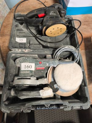 une image représentant une boîte à outils contenant une ponceuse, une ponceuse et d'autres objets