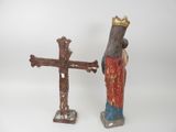 two figurines of a man with a crown and a cross