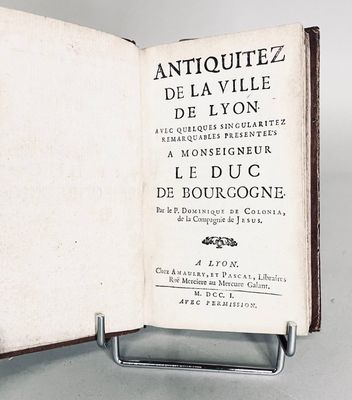 an open book with a black and white title on it