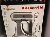 a box for a kitchen aid mixer on a shelf