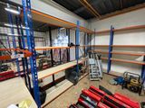 a room with shelves and a ladder in it