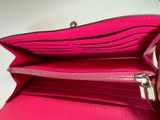 the inside of a pink purse with a zipper on it