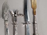 five different types of silverware laid out on a table