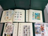 a lot of stamps in a green box on the table