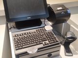 a laptop computer sitting on top of a white table
