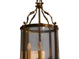 an image of a lantern hanging from the ceiling with two candles