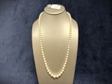 a close up of a necklace on a mannequin on a mannequin