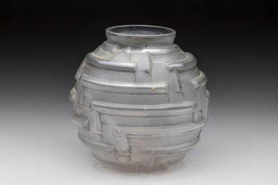 a glass vase that is sitting on a table