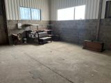 a room that has a stove and a microwave in it