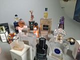 many different types of perfume bottles on a table
