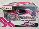 pink and white remote control toy car in a box on a white surface