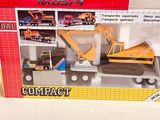 a box with a toy truck and a construction vehicle