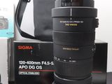 a camera and a lens on a table next to a camera case