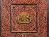 an ornate wooden box with a decorative design on it